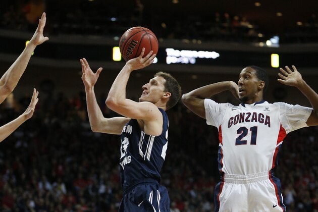 BYU's Skyler Halford shoots near Gonzaga's Eric McClellan (21) in the second half of the West Coast Conference tournament championship NCAA college basketball game Tuesday, March 10, 2015, in Las Vegas. Gonzaga won 91-75. (AP Photo/John Locher)