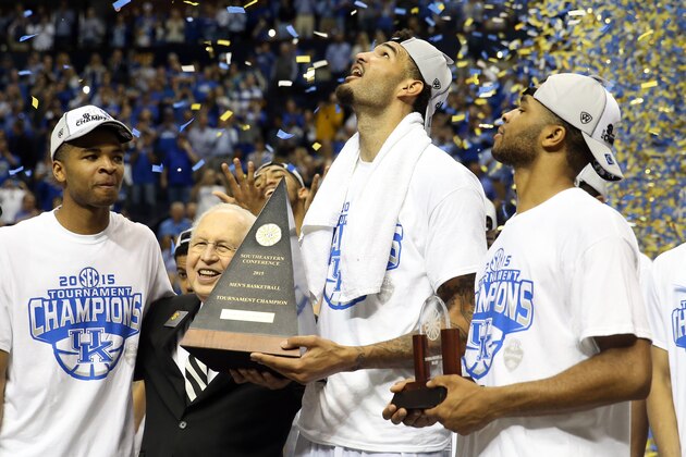 NASHVILLE, TN - MARCH 15:  Willie Cauley-Stein #15 of the Kentucky Wildcats celebrates with the trophy on the court with his teammates after defeating the Arkansas Razorbacks 78-63 in the championship game of the SEC basketball tournament at Bridgestone Arena on March 15, 2015 in Nashville, Tennessee.  (Photo by Andy Lyons/Getty Images)