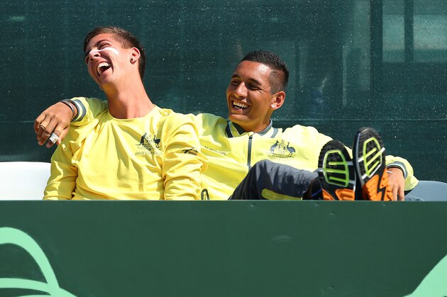 PERTH, AUSTRALIA - SEPTEMBER 14: Thanasi Kokkinakis and Nick Kyrgios of Australia look on from the team bench during the reverse singles match between Sam Groth and Temur Ismailov of Uzbekistan during the Davis Cup World Group Playoff tie between Australia and Uzbekistan at Cottesloe Tennis Club on September 14, 2014 in Perth, Australia.  (Photo by Paul Kane/Getty Images)