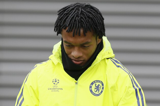 Chelsea's Juan Cuadrado arrives for a training session at their training ground in Cobham, England, Monday, Feb. 16, 2014. Chelsea will play Paris Saint Germain in a Champions League knock out round of sixteen in Paris on Tuesday. (AP Photo/Kirsty Wigglesworth)
