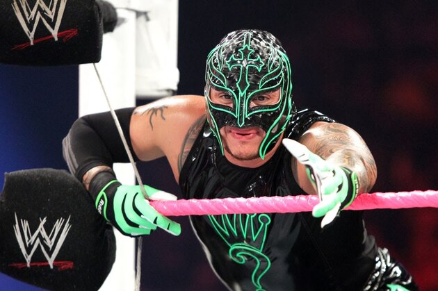 World Wrestling Entertainment star Rey Mysterio plays with a school boy in Mumbai, India, Tuesday, March 13, 2007. Ray urged children to study and become good human beings. (AP Photo/Rajesh Nirgude)