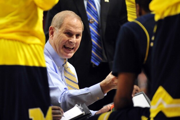 Mar 13, 2015; Chicago, IL, USA; Michigan Wolverines head coach John Beilein talks with his team in a timeout during the first half in the quarterfinals of the Big Ten Tournament at the United Center. Mandatory Credit: David Banks-USA TODAY Sports