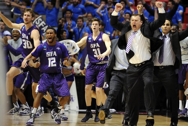 Mar 21, 2014; San Diego, CA, USA; Stephen F. Austin Lumberjacks head coach Danny Kaspar celebrates with his players after defeating the VCU Rams in a men's college basketball game during the second round of the 2014 NCAA Tournament at Viejas Arena. Mandatory Credit: Christopher Hanewinckel-USA TODAY Sports