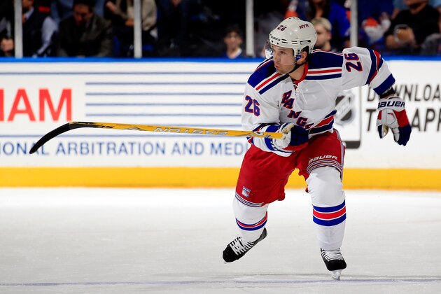 UNIONDALE, NY - MARCH 10: Martin St. Louis #26 of the New York Rangers skates against the New York Islanders during a game at the Nassau Veterans Memorial Coliseum on March 10, 2015 in Uniondale, New York.  (Photo by Alex Trautwig/Getty Images)