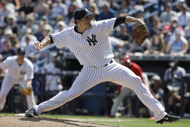New York Yankees pitcher Nathan Eovaldi throws in the first inning of an exhibition spring training baseball game against the Philadelphia Phillies, Wednesday, March 4, 2015, in Tampa, Fla. (AP Photo/Lynne Sladky)