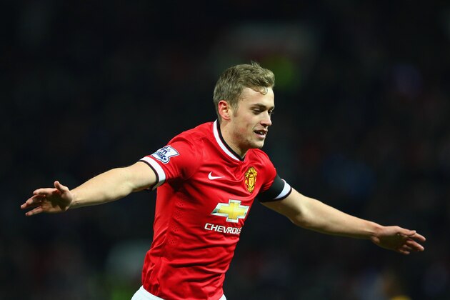 MANCHESTER, ENGLAND - FEBRUARY 03:  James Wilson of Manchester United celebrates scoring their third goal during the FA Cup Fourth round replay match between Manchester United and Cambridge United at Old Trafford on February 3, 2015 in Manchester, England.  (Photo by Clive Mason/Getty Images)