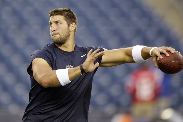 New England Patriots quarterback Tim Tebow warms up before an NFL preseason football game against the New York Giants Thursday, Aug. 29, 2013, in Foxborough, Mass. (AP Photo/Mary Schwalm)