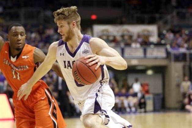 Stephen F. Austin's Thomas Walkup, right, drives toward the basket as Sam Houston State's DeMarcus Gatlin (11) defends during the first half of an NCAA college basketball game in the championship of the Southland Conference tournament Saturday, March 14, 2015, in Katy, Texas. (AP Photo/David J. Phillip)