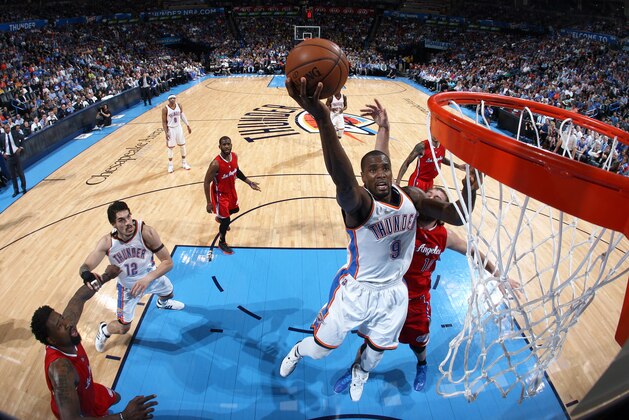 OKLAHOMA CITY, OK - MARCH 11: Serge Ibaka #9 of the Oklahoma City Thunder goes up for a shot against the Los Angeles Clippers on March 11, 2015 at the Chesapeake Energy Arena in Oklahoma City, Oklahoma. NOTE TO USER: User expressly acknowledges and agrees that, by downloading and or using this Photograph, user is consenting to the terms and conditions of the Getty Images License Agreement. Mandatory Copyright Notice: Copyright 2015 NBAE (Photo by Layne Murdoch/NBAE via Getty Images)