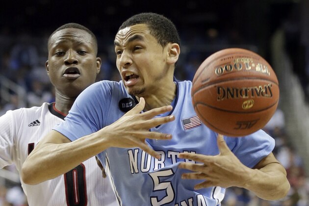 North Carolina's Marcus Paige (5) loses the ball as Louisville's Terry Rozier (0) defends during the second half of an NCAA college basketball game in the quarterfinals of the Atlantic Coast Conference tournament in Greensboro, N.C., Thursday, March 12, 2015. (AP Photo/Gerry Broome)