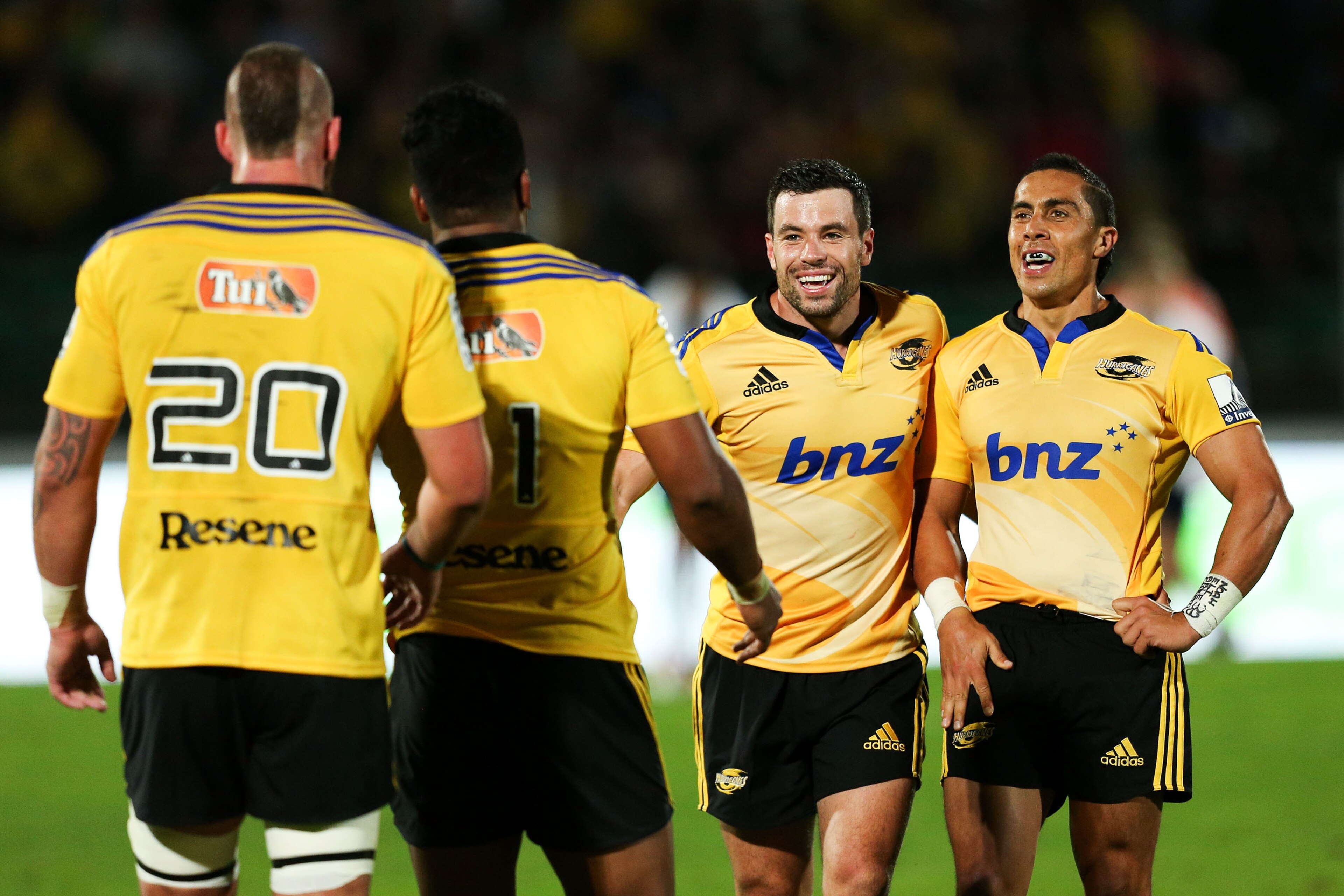 PALMERSTON NORTH, NEW ZEALAND - MARCH 13:  (L-R) Blade Thomson, Julian Savea, James Marshall and Chris Smylie of the Hurricanes celebrate the win during the round five Super Rugby match  between the Hurricanes and the Blues at Arena Manawatu on March 13, 2015 in Palmerston North, New Zealand.  (Photo by Hagen Hopkins/Getty Images)