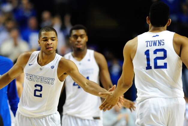 Mar 15, 2015; Nashville, TN, USA; Kentucky Wildcats guard Aaron Harrison (2) shakes hands with forward Karl-Anthony Towns (12) during the second half of the SEC Conference championship game at Bridgestone Arena. Kentucky Wildcats defeated Arkansas Razorbacks 78-63. Mandatory Credit: Joshua Lindsey-USA TODAY Sports