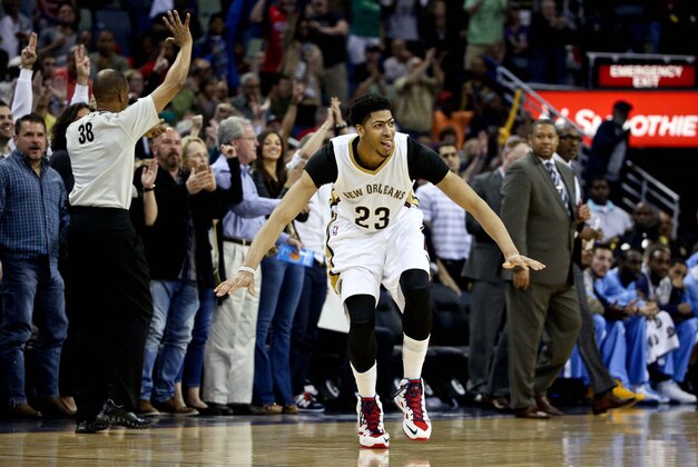 Mar 15, 2015; New Orleans, LA, USA; New Orleans Pelicans forward Anthony Davis (23) reacts after scoring against the Denver Nuggets in the fourth quarter of a game at the Smoothie King Center. The Nuggets defeated the Pelicans 118-111 in double overtime. Mandatory Credit: Derick E. Hingle-USA TODAY Sports