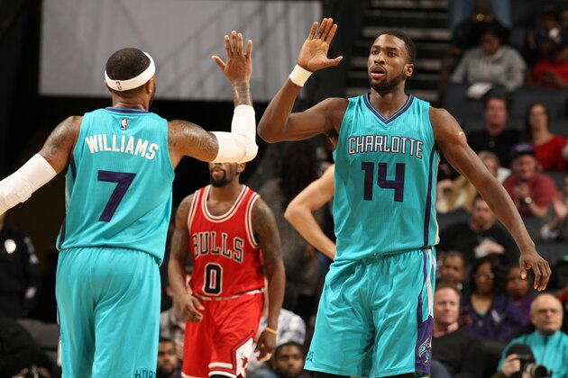 CHARLOTTE, NC - MARCH 13: Mo Williams #7 and Michael Kidd-Gilchrist #14 of the Charlotte Hornetsduring the game against the Chicago Bulls at the Time Warner Cable Arena on March 13, 2015 in Charlotte, North Carolina. NOTE TO USER: User expressly acknowledges and agrees that, by downloading and or using this photograph, User is consenting to the terms and conditions of the Getty Images License Agreement.  Mandatory Copyright Notice:  Copyright 2015 NBAE (Photo by Kent Smith/NBAE via Getty Images)