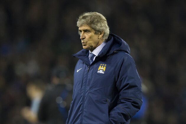 Manchester City's manager Manuel Pellegrini makes his way off the pitch after his team's 1-0 loss in the English Premier League soccer match between Burnley and Manchester City at Turf Moor Stadium, Burnley, England, Saturday March 14, 2015. (AP Photo/Jon Super)