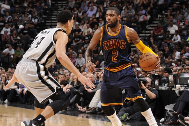 SAN ANTONIO, TX - MARCH 12:  Kyrie Irving #2 of the Cleveland Cavaliers dribbles the ball against the San Antonio Spurs on March 12, 2015 at the AT&T Center in San Antonio, Texas. NOTE TO USER: User expressly acknowledges and agrees that, by downloading and or using this photograph, User is consenting to the terms and conditions of the Getty Images License Agreement. Mandatory Copyright Notice: Copyright 2015 NBAE (Photo by Bill Baptist/NBAE via Getty Images)