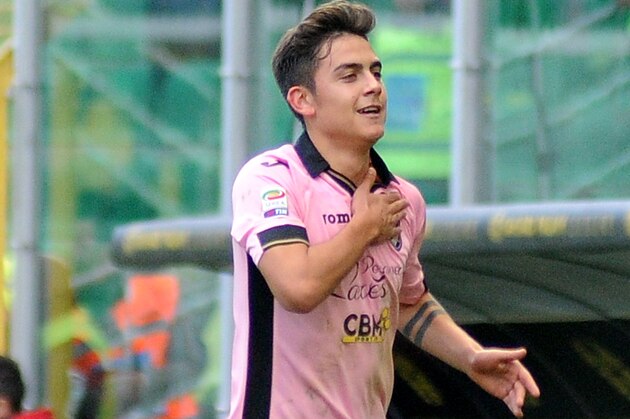 Palermo's Paulo Dybala celebrates after scoring during the Serie A soccer match between Palermo and Cagliari, in Palermo, Italy, Tuesday, Jan. 6,  2015. (AP Photo/Alessandro Fucarini)