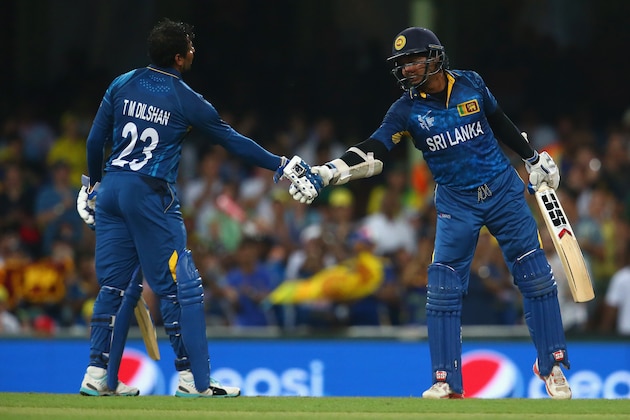 SYDNEY, AUSTRALIA - MARCH 08:  Tillakaratne Dilshan of Sri Lanka congratulates Kumar Sangakkara of Sri Lanka after he passed the milestone of 14000 one day international runs during the 2015 ICC Cricket World Cup match between Australia and Sri Lanka at Sydney Cricket Ground on March 8, 2015 in Sydney, Australia.  (Photo by Mark Kolbe/Getty Images)
