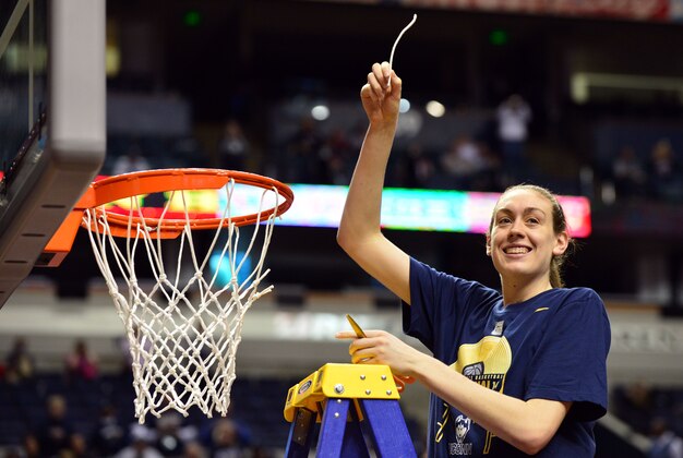 Apr 8, 2014; Nashville, TN, USA; Connecticut Huskies forward Breanna Stewart (30) cuts the net after defeating the Notre Dame Fighting Irish in the championship game of the Final Four in the 2014 NCAA Womens Division I Championship tournament at Bridgestone Arena. Connecticut wins 79-58. Mandatory Credit: Don McPeak-USA TODAY Sports