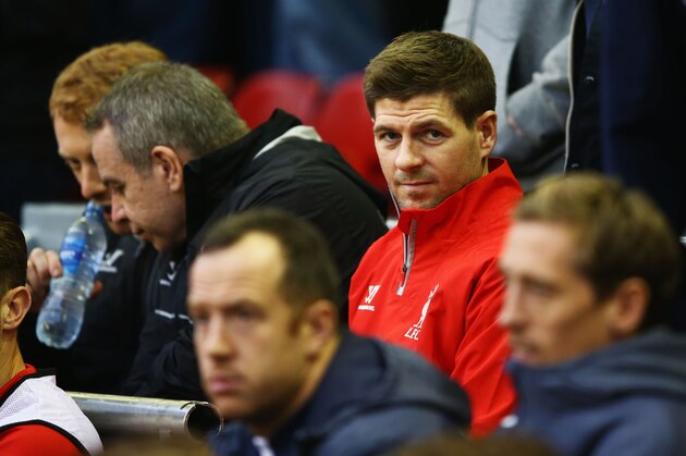 LIVERPOOL, ENGLAND - NOVEMBER 29:  Steven Gerrard of Liverpool looks on from the substitutes bench prior to the Barclays Premier League match between Liverpool and Stoke City at Anfield on November 29, 2014 in Liverpool, England.  (Photo by Richard Heathcote/Getty Images)