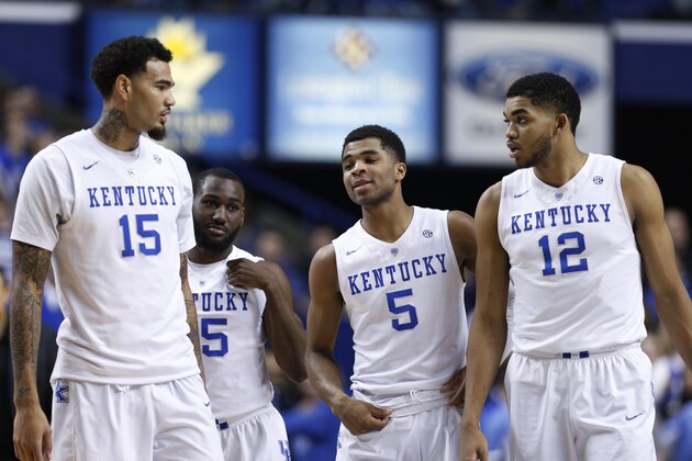LEXINGTON, KY - JANUARY 20: Karl-Anthony Towns #12, Andrew Harrison #5, Dominique Hawkins #25 and Willie Cauley-Stein #15 of the Kentucky Wildcats look on against the Vanderbilt Commodores during the game at Rupp Arena on January 20, 2015 in Lexington, Kentucky. Kentucky defeated Vanderbilt 65-57. (Photo by Joe Robbins/Getty Images)