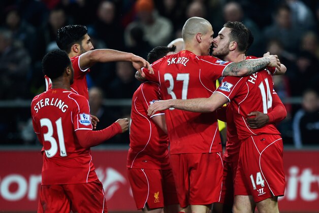 SWANSEA, WALES - MARCH 16:  Jordan Henderson of Liverpool celebrates the opening goal with team mates during the Barclays Premier League match between Swansea City and Liverpool at Liberty Stadium on March 16, 2015 in Swansea, Wales.  (Photo by Mike Hewitt/Getty Images)