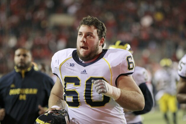 Michigan's Jack Miller runs off the field following an NCAA college football game between Nebraska and Michigan in Lincoln, Neb., Saturday, Oct. 27, 2012. Nebraska won the game 23-9. (AP Photo/Nati Harnik)
