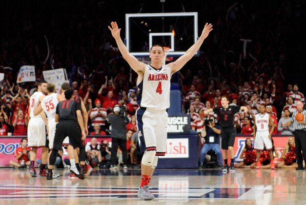 Mar 7, 2015; Tucson, AZ, USA; Arizona Wildcats guard T.J. McConnell (4) waves as he walks off of the court for the last time at McKale Center. Arizona won 91-69 to win the regular season Pac-12 championship. Mandatory Credit: Casey Sapio-USA TODAY Sports