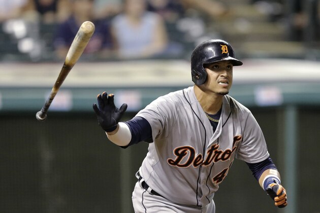 Detroit Tigers' Victor Martinez watches his three-run home run off Cleveland Indians relief pitcher Josh Tomlin in the 11th inning of a baseball game, Thursday, Sept. 4, 2014, in Cleveland. (AP Photo/Tony Dejak)