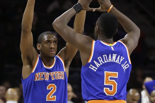 New York Knicks guard Langston Galloway (2) is congratulated by teammate Tim Hardaway Jr., after Galloway's game tying shot  in regulation during the second half of an NBA basketball game against the Detroit Pistons, Friday, Feb. 27, 2015 in Auburn Hills, Mich. The Knicks defeated the Pistons 121-115  in double overtime. (AP Photo/Carlos Osorio)