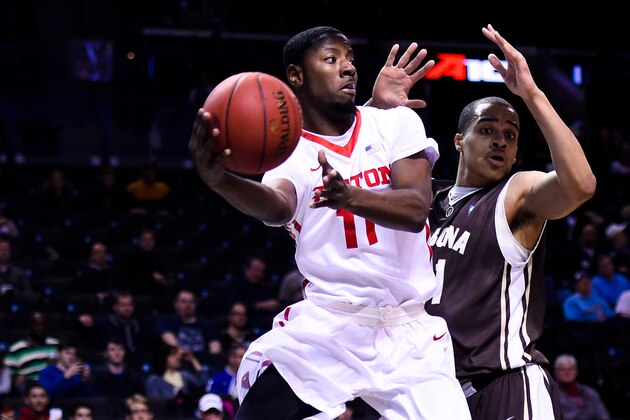 NEW YORK, NY - MARCH 13: Scoochie Smith #11 of the Dayton Flyers attempts to pass around Dion Wright #21 of the St. Bonaventure Bonnies during a quarterfinal game in the 2015 Men's Atlantic 10 Basketball Tournament at the Barclays Center on March 13, 2015 in the Brooklyn borough of New York City.  (Photo by Alex Goodlett/Getty Images)