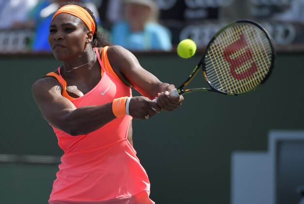Serena Williams returns a volley from Sloane Stephens during their match at the BNP Paribas Open tennis tournament, Tuesday, March 17, 2015 in Indian Wells, Calif. (AP Photo/Mark J. Terrill)