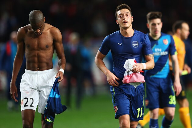 MONACO - MARCH 17:  Geoffrey Kondogbia of Monaco and Mesut Oezil of Arsenal swaps shirts at half time during the UEFA Champions League round of 16 second leg match between AS Monaco and Arsenal at Stade Louis II on March 17, 2015 in Monaco, Monaco.  (Photo by Michael Steele/Getty Images)