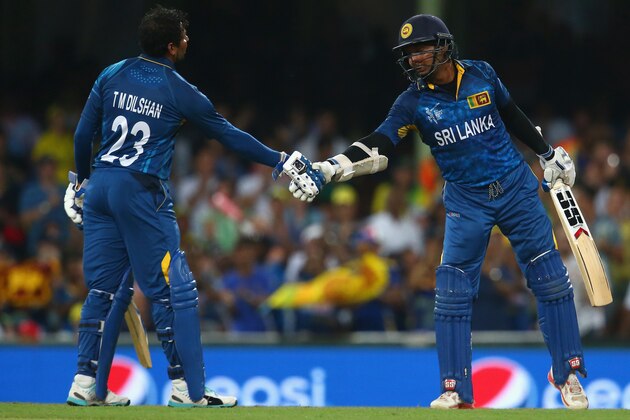 SYDNEY, AUSTRALIA - MARCH 08:  Tillakaratne Dilshan of Sri Lanka congratulates Kumar Sangakkara of Sri Lanka after he passed the milestone of 14000 one day international runs during the 2015 ICC Cricket World Cup match between Australia and Sri Lanka at Sydney Cricket Ground on March 8, 2015 in Sydney, Australia.  (Photo by Mark Kolbe/Getty Images)