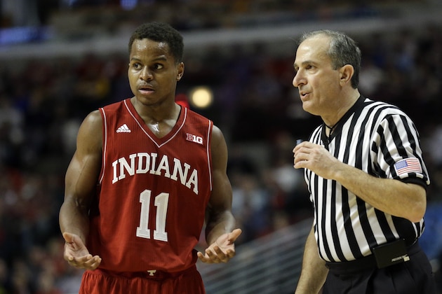 Indiana's Yogi Ferrell (11) questions referee Ray Perone in the second half of an NCAA college basketball game against Maryland in the quarterfinals of the Big Ten Conference tournament in Chicago, Friday, March 13, 2015. Maryland defeated Indiana 75-69. (AP Photo/Nam Y. Huh)