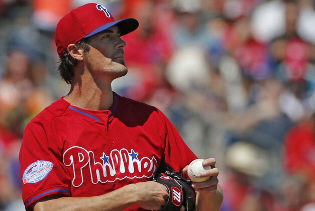Philadelphia Phillies starting pitcher Cole Hamels reacts on the mound in a spring training baseball game in Clearwater, Fla., Monday, March 16, 2015. Hamels allowed five runs in two innings. (AP Photo/Kathy Willens)