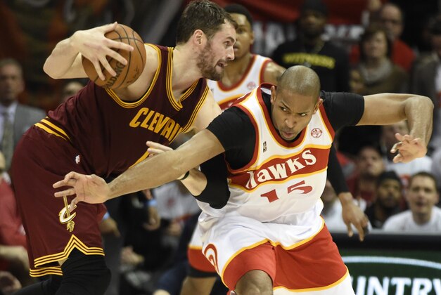 Mar 6, 2015; Atlanta, GA, USA; Atlanta Hawks center Al Horford (15) tries to steal the ball away form Cleveland Cavaliers forward Kevin Love (0) during the second half at Philips Arena. The Hawks won 106-97. Mandatory Credit: Dale Zanine-USA TODAY Sports