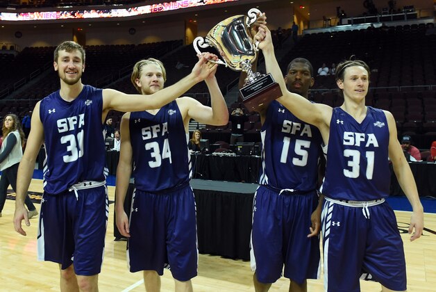 LAS VEGAS, NV - NOVEMBER 28:  Tanner Clayton #30, Jacob Parker #34, Bobby King #15 and Connor Brooks #31 of the Stephen F. Austin Lumberjacks celebrate with the upper division championship trophy after defeating the Austin Peay Governors 83-62 during the 2014 Continental Tire Las Vegas Invitational basketball tournament at the Orleans Arena on November 28, 2014 in Las Vegas, Nevada.  (Photo by Ethan Miller/Getty Images)