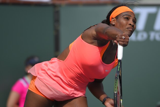 Serena Williams serves to Sloane Stephens during their match at the BNP Paribas Open tennis tournament, Tuesday, March 17, 2015 in Indian Wells, Calif. (AP Photo/Mark J. Terrill)