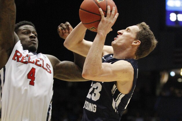 Brigham Young's Skyler Halford (23) shoots against Mississippi's M.J. Rhett (4) in the second half of a first round NCAA tournament gameTuesday, March 17, 2015 in Dayton, Ohio. (AP Photo/Skip Peterson)