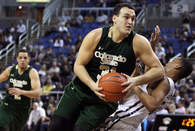 Mar 4, 2015; Reno, NV, USA; Colorado State Rams forward J.J. Avila (31) drives the ball past Nevada Wolf Pack guard Eric Cooper Jr. (21) in the first half of their NCAA basketball game at Lawlor Events Center. Mandatory Credit: Lance Iversen-USA TODAY Sports