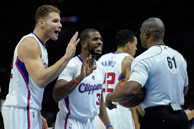 LOS ANGELES, CA - DECEMBER 29:  Chris Paul #3 and Blake Griffin #32 of the Los Angeles Clippers argue a foul call with referee Courtney Kirkland #61 during a 101-97 Clipper win over the Utah Jazz at Staples Center on December 29, 2014 in Los Angeles, California.   NOTE TO USER: User expressly acknowledges and agrees that, by downloading and or using this Photograph, user is consenting to the terms and condition of the Getty Images License Agreement.  (Photo by Harry How/Getty Images)