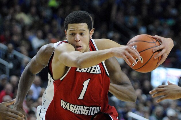 Eastern Washington's Tyler Harvey (1) drives to the basket during the first half of his team's 82-65 loss to Connecticut in an NCAA college basketball game in Bridgeport, Conn., Saturday, Dec. 28, 2013. (AP Photo/Fred Beckham)