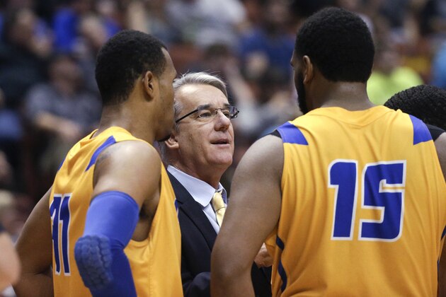 UC Santa Barbara coach Bob Williams talks with Alan Williams, right, John Green, left, and others during the first half of an NCAA college basketball game against UC Irvine in the semifinals of the Big West Conference tournament, Friday, March 13, 2015, in Anaheim, Calif. (AP Photo/Jae C. Hong)