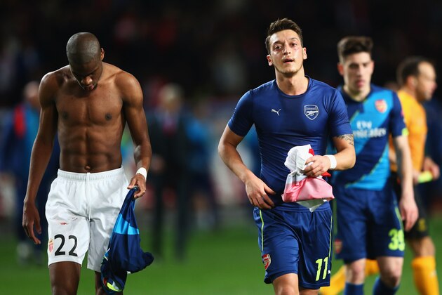MONACO - MARCH 17:  Geoffrey Kondogbia of Monaco and Mesut Oezil of Arsenal swaps shirts at half time during the UEFA Champions League round of 16 second leg match between AS Monaco and Arsenal at Stade Louis II on March 17, 2015 in Monaco, Monaco.  (Photo by Michael Steele/Getty Images)