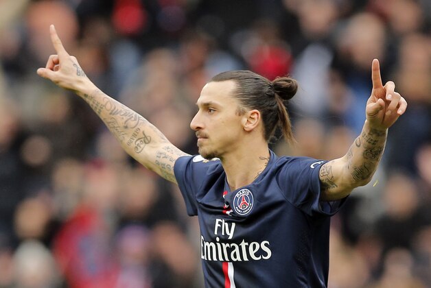 Paris St. Germain's Zlatan Ibrahimovic celebrates his goal during the French league one soccer match between PSG and Caen, in Paris, France, Saturday, Feb. 14, 2015. (AP Photo/Christophe Ena)