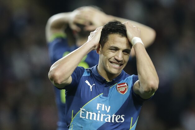 Arsenal's Alexis Sanchez reacts during the Champions League round of 16 second leg soccer match between Monaco and Arsenal at Louis II stadium in Monaco, Tuesday, March 17, 2015. (AP Photo/Lionel Cironneau)