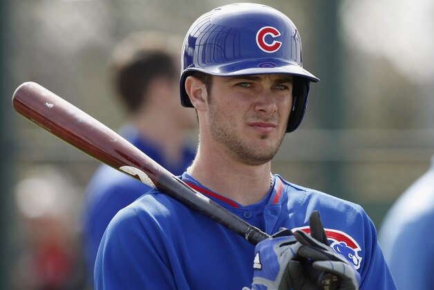FILE - In this Feb. 21, 2014 file photo, Chicago Cubs third baseman Kris Bryant prepares to take batting practice during spring training baseball practice in Mesa, Ariz. Bryant, 22, is a big-time prospect.  (AP Photo/Rick Scuteri, File)