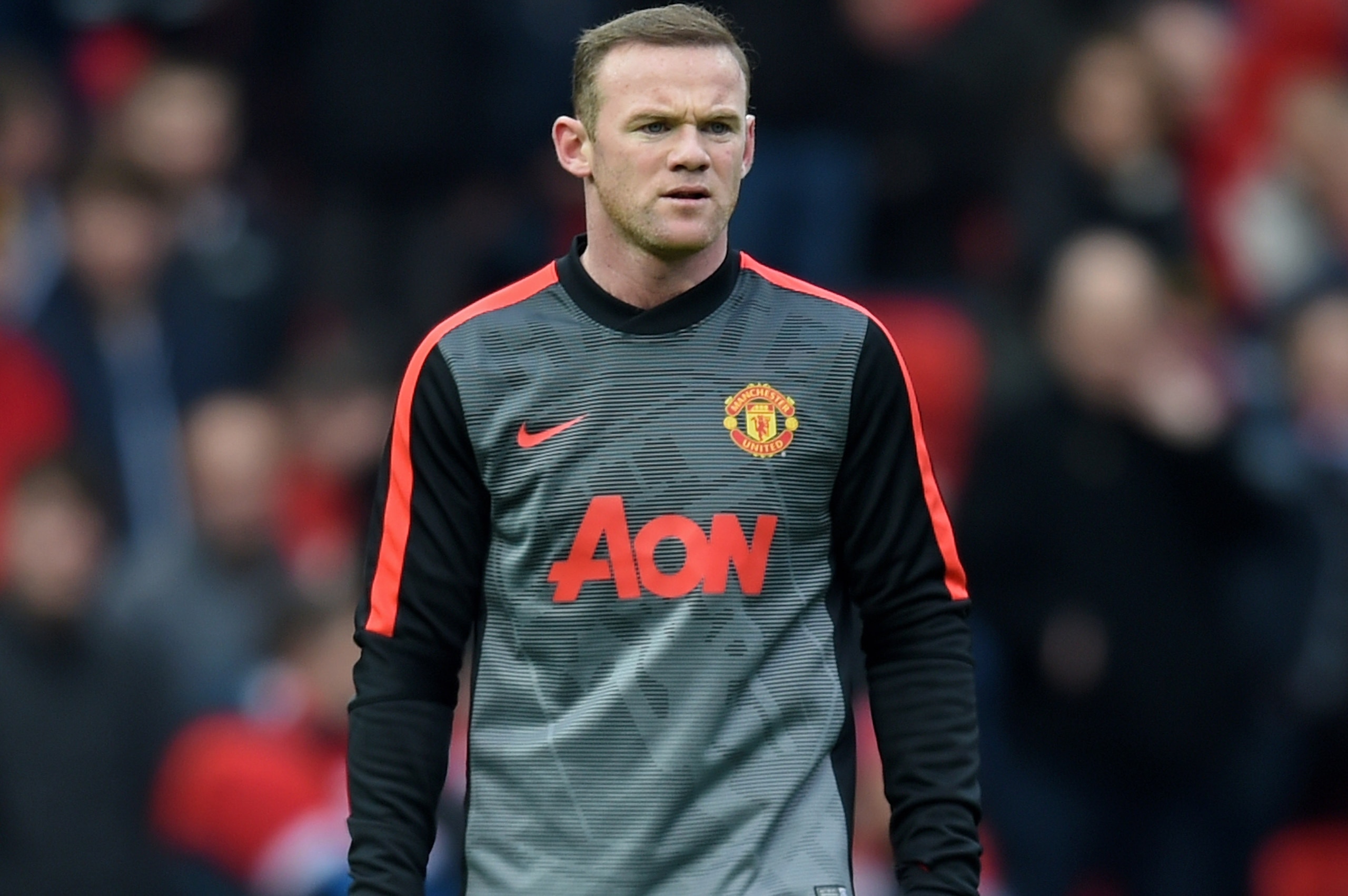 MANCHESTER, ENGLAND - MARCH 15: Wayne Rooney of Manchester United warms up prior to kickoff during the Barclays Premier League match between Manchester United and Tottenham Hotspur at Old Trafford on March 15, 2015 in Manchester, England. (Photo by Michael Regan/Getty Images) MANCHESTER, ENGLAND - MARCH 15: Wayne Rooney of Manchester United warms up prior to kickoff during the Barclays Premier League match between Manchester United and Tottenham Hotspur at Old Trafford on March 15, 2015 in Manchester, England. (Photo by Michael Regan/Getty Images)