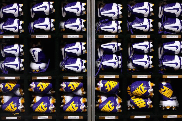 The Nike logo is seen on LSU cleats during the second half of an NCAA college football game in Baton Rouge, La., Saturday, September 6, 2014. (AP Photo/Jonathan Bachman)